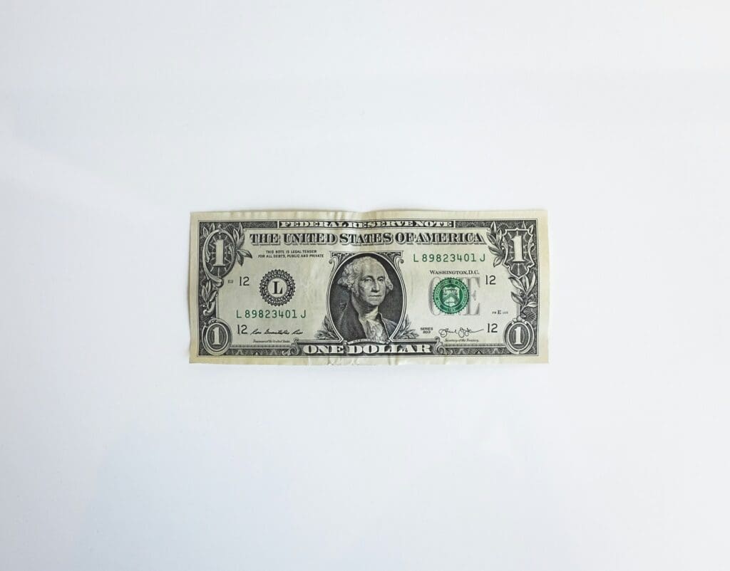U.S. one dollar bill with George Washington's portrait and green seal