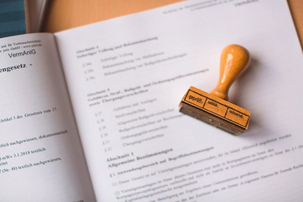 Stamped legal document in German—signifies official approval and validation. Ideal visual for topics like compliance, auditing, or legal workflows.