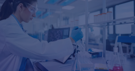 Medical laboratory worker mixing chemicals