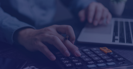 Amidst a sea of financial documents, a meticulous individual calculates figures, ensuring every detail is accounted for. The calculator, a trusted companion, aids in navigating the complexities of numbers and reports, as the pen hovers, ready to jot down important notes.