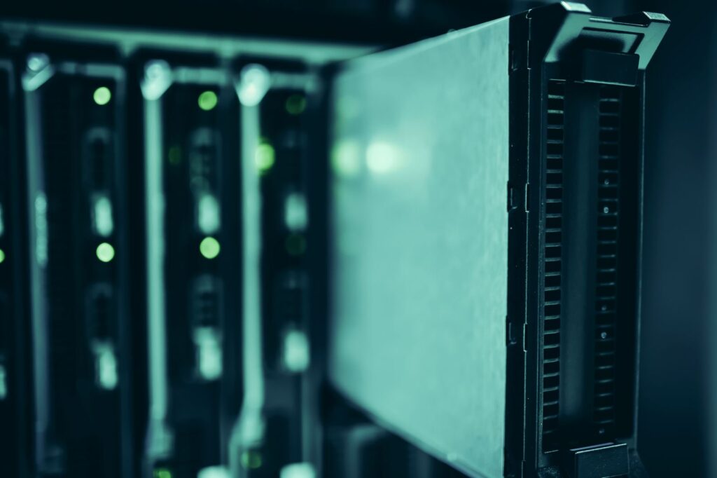 Close-up of blade servers with status LEDs in a data center rack