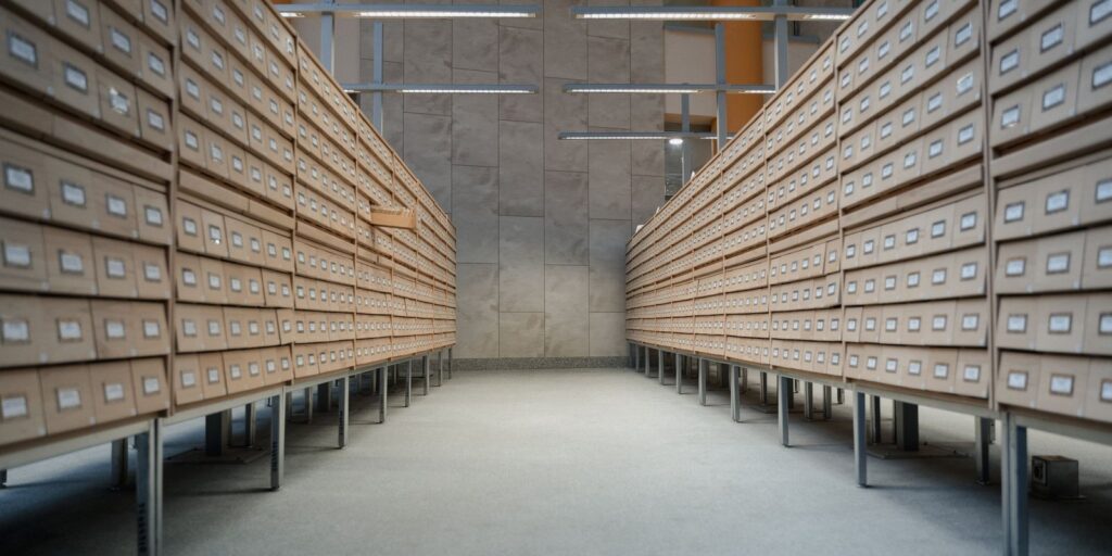 Rows of card catalogue drawers in an archive room