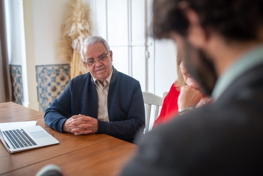 Client meeting with an accountant over a laptop
