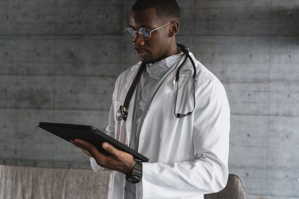 Clinician reviewing patient information on a tablet