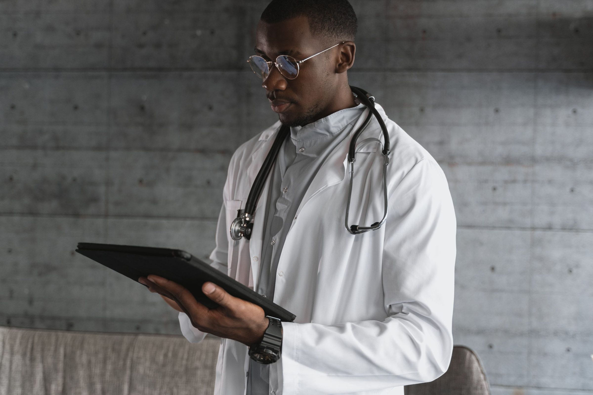 Clinician reviewing patient information on a tablet