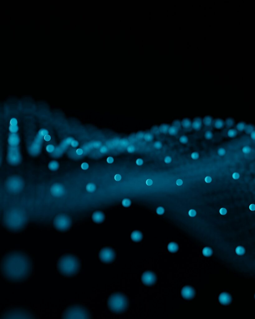 Abstract glowing blue data wave pattern on a dark background