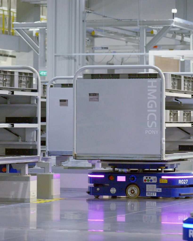 Automated warehouse robot carrying a storage rack